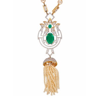 Elegant gold and diamond pendant with green gemstone and pearl tassel detailing.